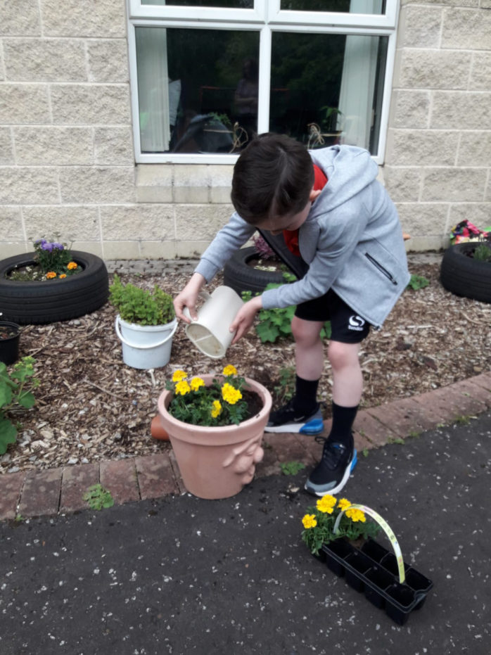 Simon Community Ensures No Child Left Behind Through New Play Learning Service Young Boy Gardening