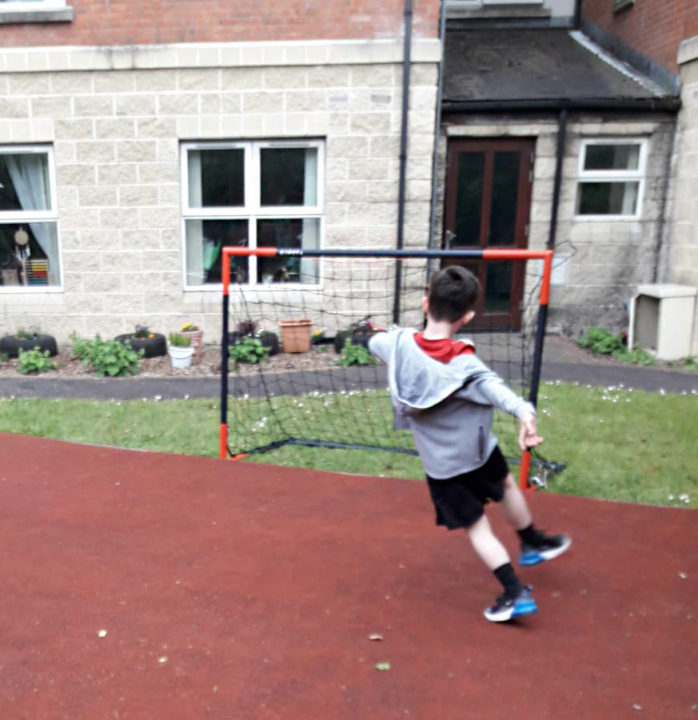 Simon Community Ensures No Child Left Behind Through New Play Learning Service Young Boy Playing Football