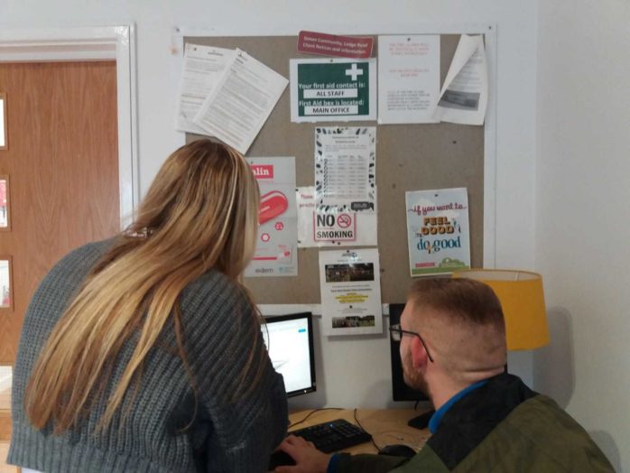 Staff in Bonds Hill helping client apply for the 100 Highstreet Voucher scheme 2